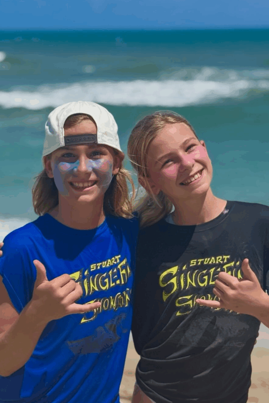 ohana-surf-shop-girls-on-beach-shaka-sign